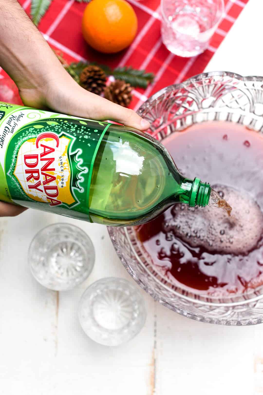 Pouring the Ginger Ale into punch bowl.