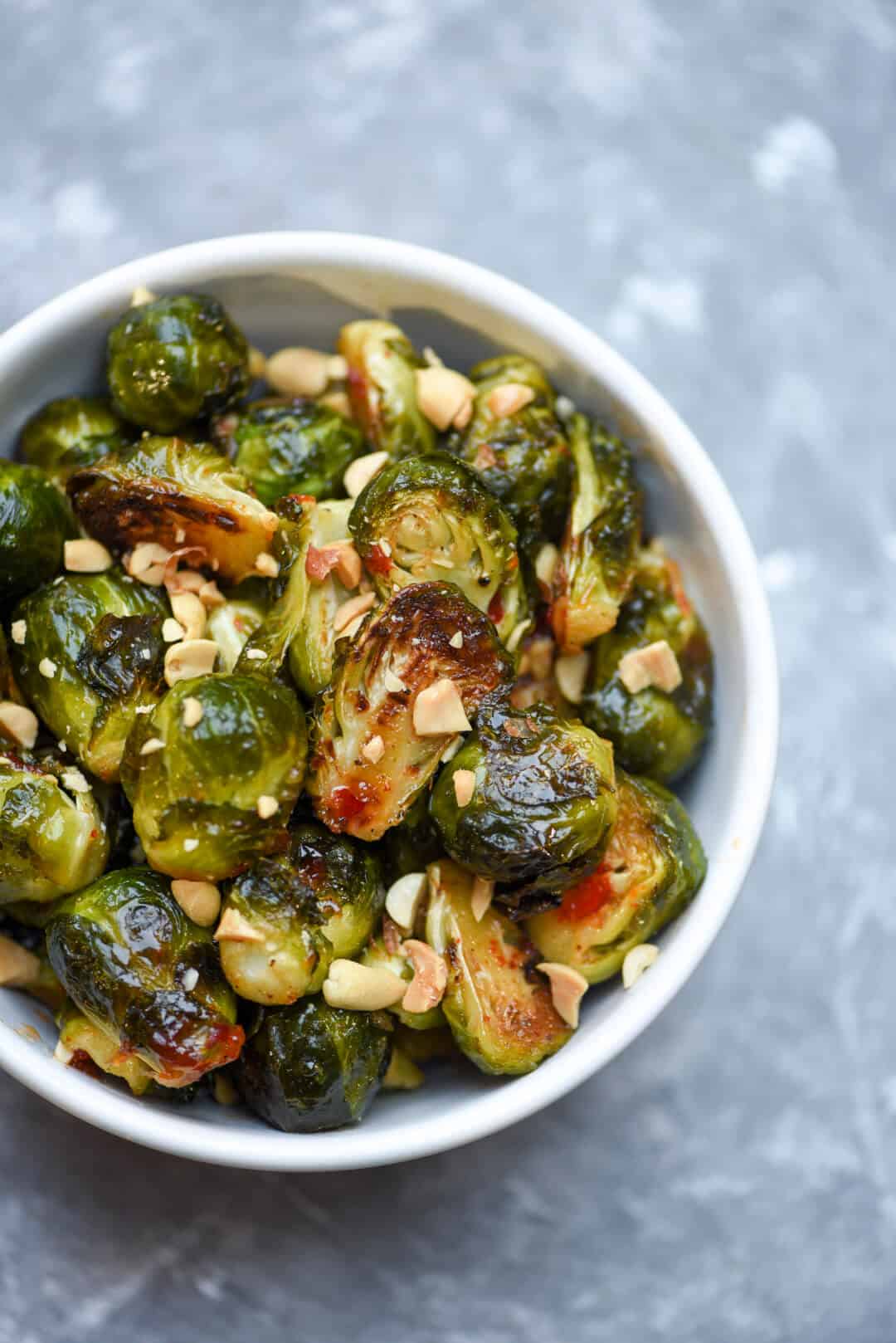 The Brussels Sprouts in a small white bowl shot from over the top.