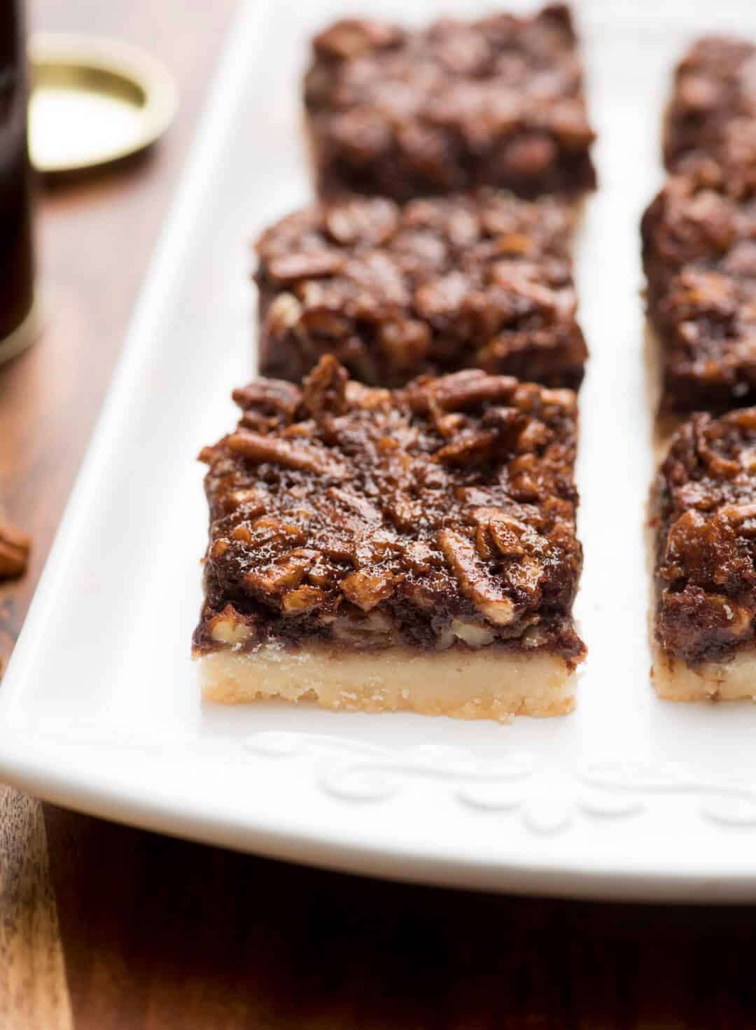 These Chocolate Bourbon Pecan Pie Bars have a shortbread crust topped with a gooey, chocolaty, bourbon-spiked pecan topping that is downright heavenly. 