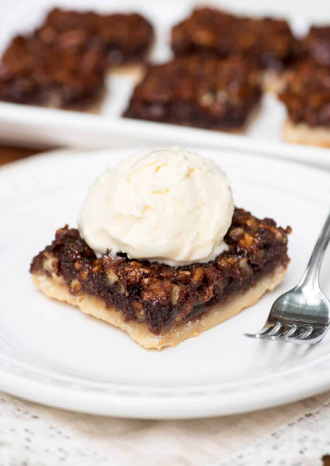 These Chocolate Bourbon Pecan Pie Bars have a shortbread crust topped with a gooey, chocolaty, bourbon-spiked pecan topping that is downright heavenly. 