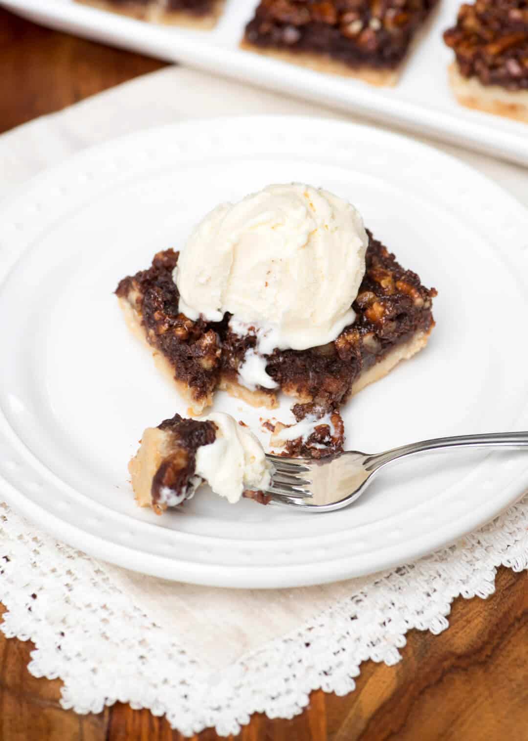 These Chocolate Bourbon Pecan Pie Bars have a shortbread crust topped with a gooey, chocolaty, bourbon-spiked pecan topping that is downright heavenly. 