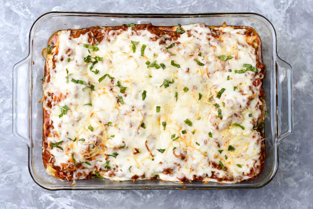 Meaty Lasagna Roll-Ups in a baking dish shot from over the top.