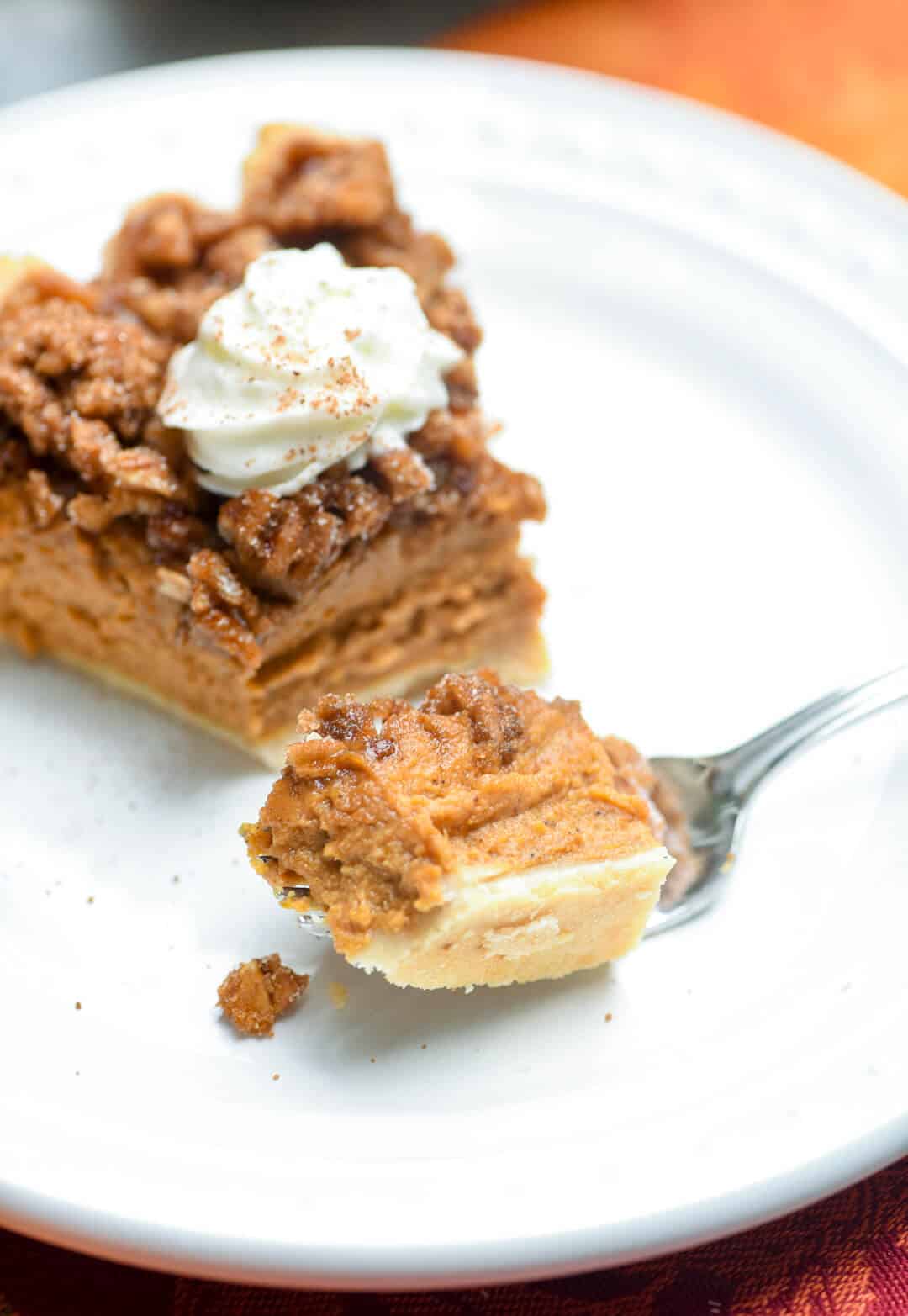 A richly spiced pumpkin pie topped with a sticky sweet pecan praline and baked to perfection. This Praline Pumpkin Pie is a delicious twist on the classic!