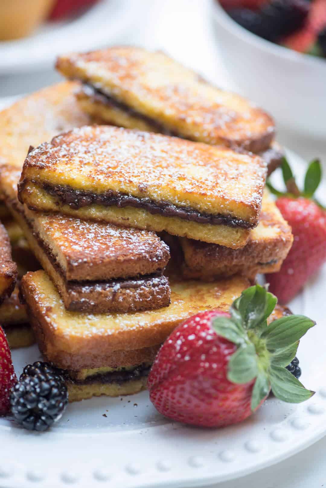 A serving of nutella stuffed french toast sticks.