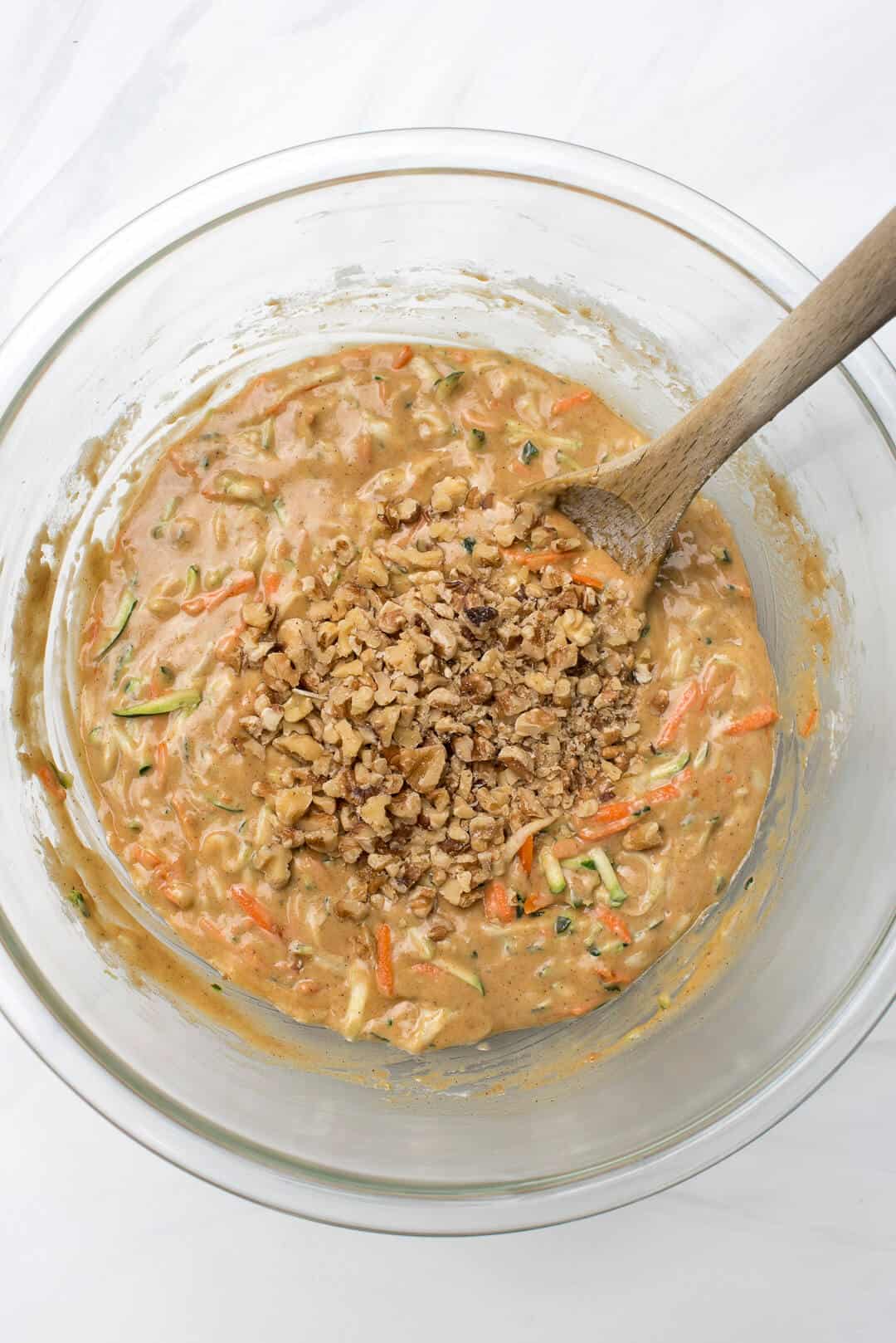 Mixing the walnuts into the batter.