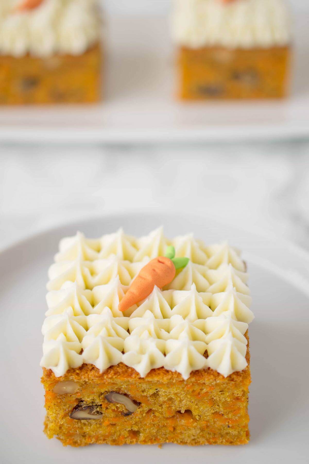 https://www.fromvalerieskitchen.com/wordpress/wp-content/uploads/2018/03/Carrot-cake-squares-1-1.jpg