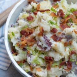 A close up of Colcannon Potatoes topped with bacon and green onions.