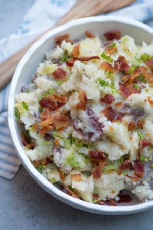 A close up of Colcannon Potatoes topped with bacon and green onions.