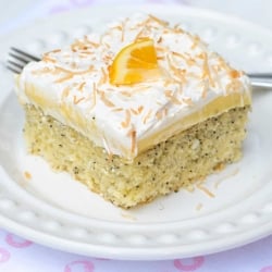 A piece of Lemon Coconut Poppy Seed Cake on a white plate.