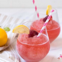 Two glasses filled with Strawberry Lemonade Frose.