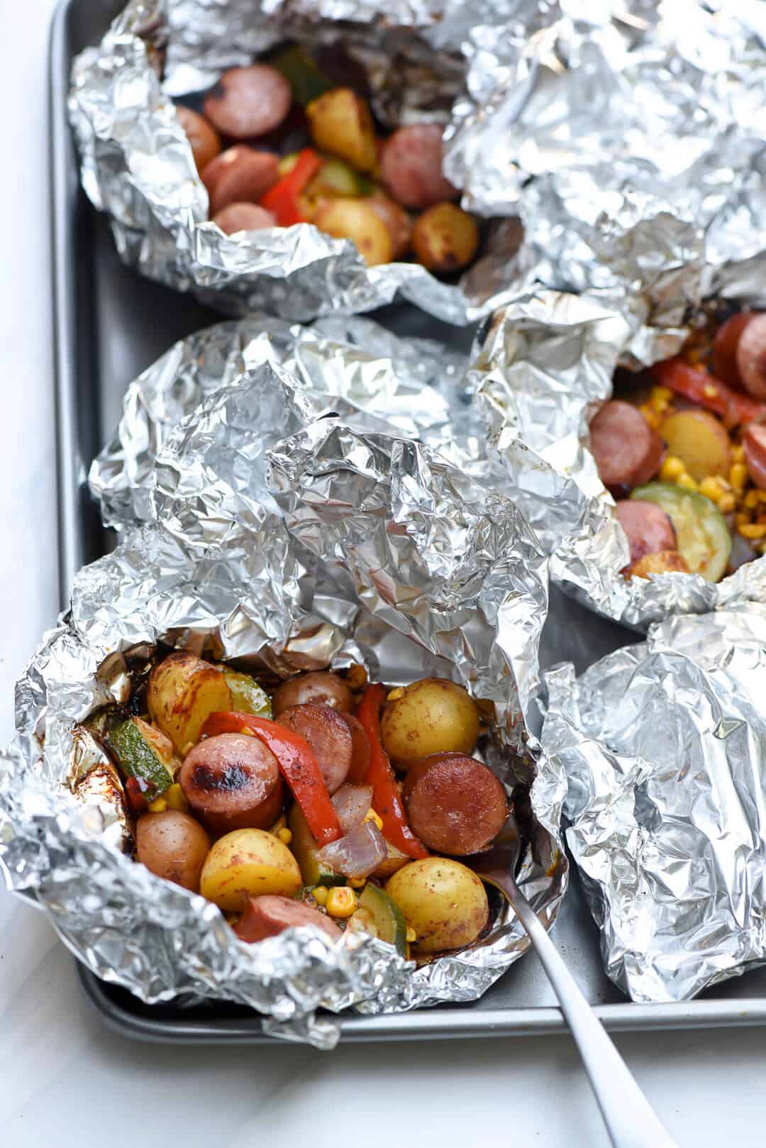 You just can't beat the foil pack method of cooking for an easy, stress-free summer meal. This Foil Pack Southwest Sausage and Potatoes takes just minutes to assemble, 15 minutes to cook, and cleanup is almost non-existent!