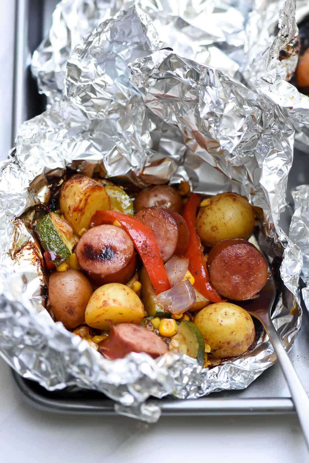 A close up shot of an open foil pack of Southwest Sausage and Potatoes.