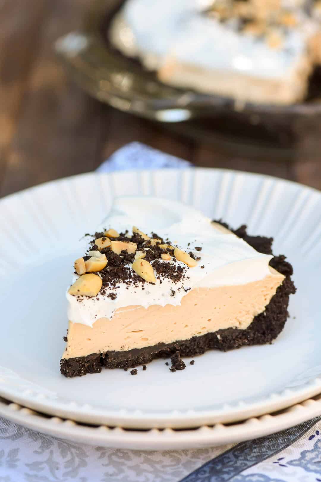 A slice of Peanut Butter Pie on a white serving plate.