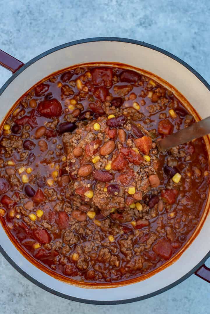 A over the top shot of the Beef and Bean Taco Chili in a Dutch oven.