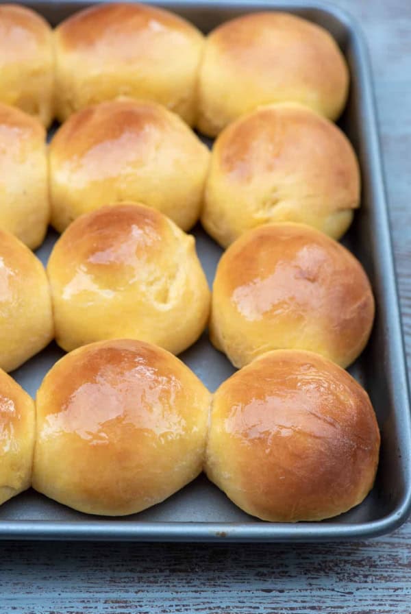 A baking sheet filled with dinner rolls.