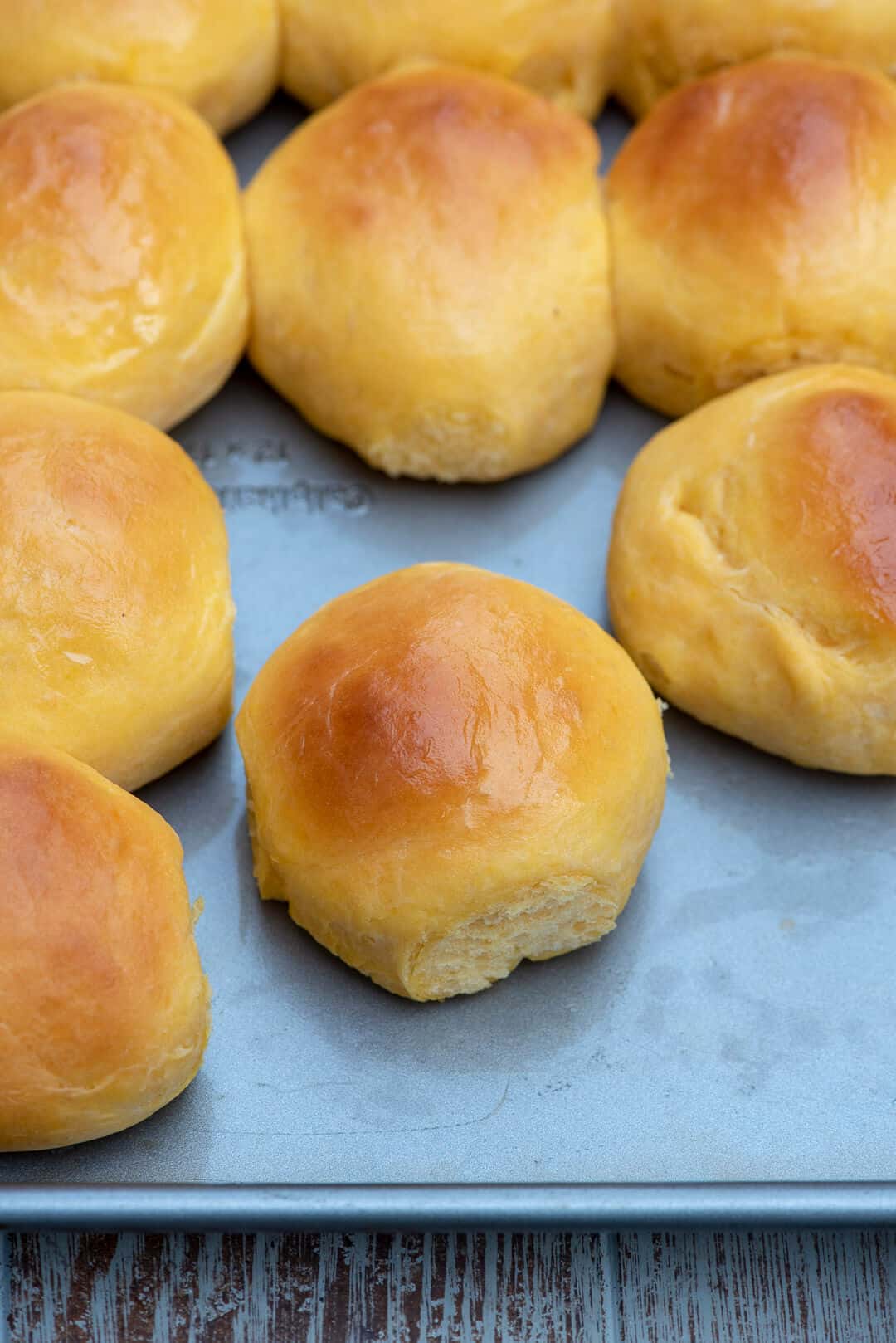 Sweet Potato Rolls fresh from the oven on a baking sheet.