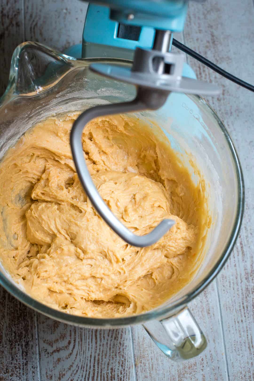 Switch to the dough hook and continue mixing, adding flour as needed.