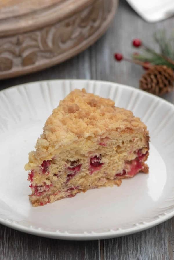 A slice of coffee cake on a white plate.
