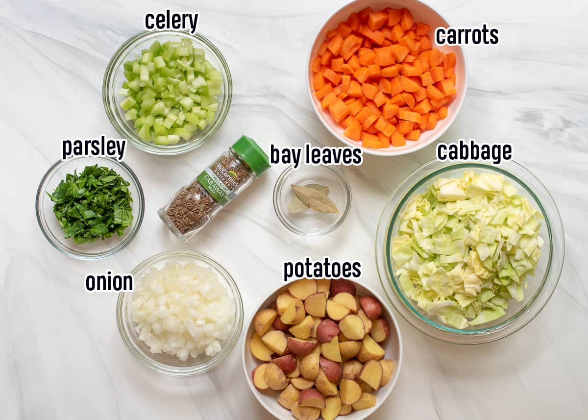 Cabbage, carrots, potatoes, and other ingredients in bowls with text.