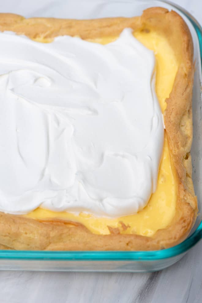 The cream puff pastry filled with the creamy filling and topped with whipped topping.