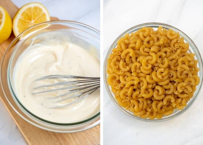 Coleslaw dressing in a small glass bowl with a whisk and a small glass bowl filled with uncooked elbow macaroni.