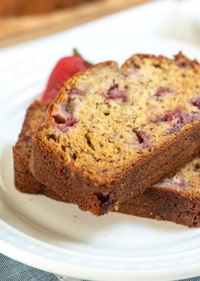 A close up shot of two slices of Strawberry Banana Bread.