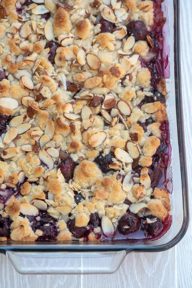 An over the top image of cherry cobbler in a 13-inch x 9-inch baking dish.