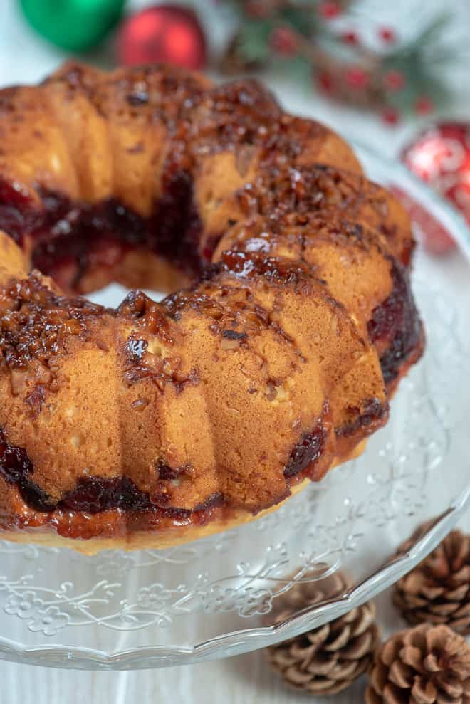 A close up image of the Cranberry Swirl Bundt Cake on the serving platter before it is glazed.