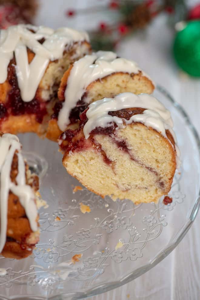 The Cranberry Swirl Bundt Cake sliced on the serving platter.