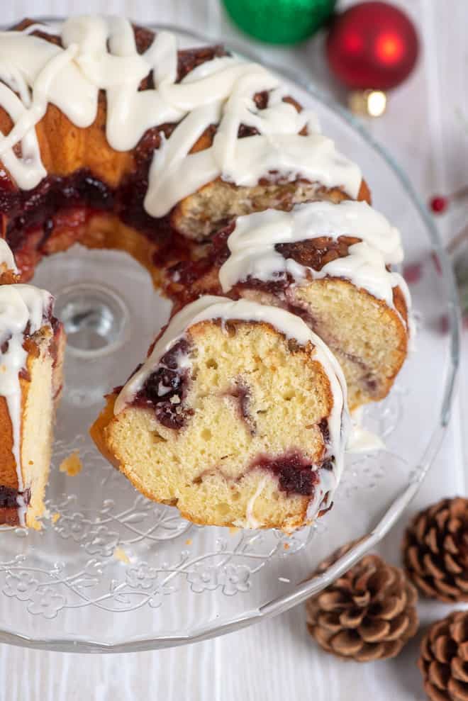 A sliced bundt cake on a cake plate.