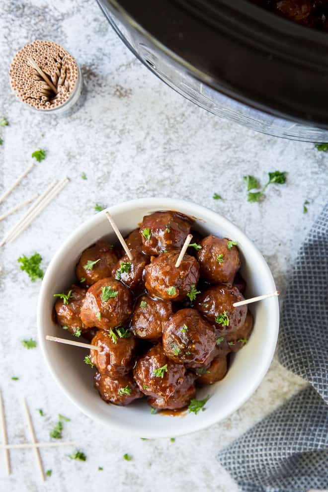 A bowl of glazed meatballs.