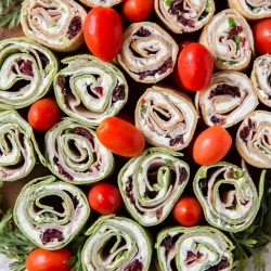 Colorful sliced pinwheels on a tray.