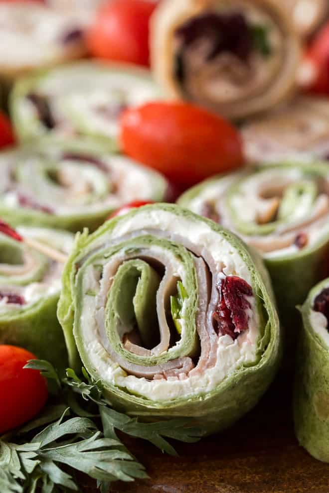 A pinwheel made with green Mission Garden Spinach Herb Wraps.