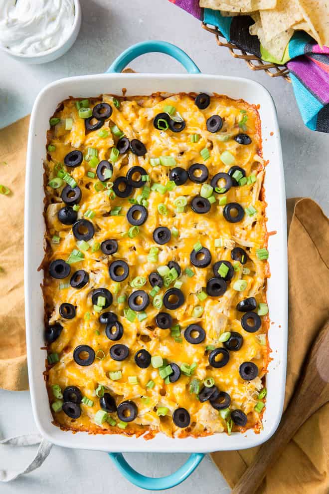 The Chicken Tamale Casserole is topped with sliced black olives and green onions after it is baked.
