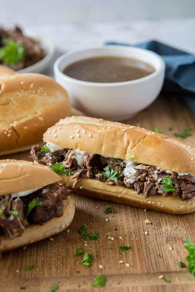 Crock-Pot French Dip Sandwiches and a bowl of au jus.