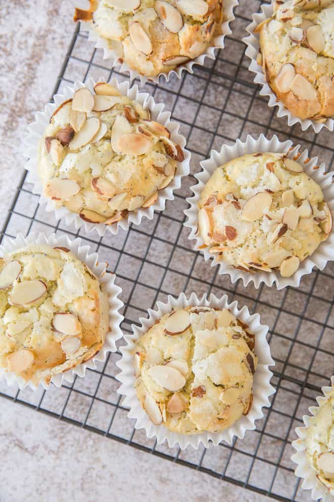 The Lemon Almond Poppy Seed Muffins are transferred to a wire rack to cool.