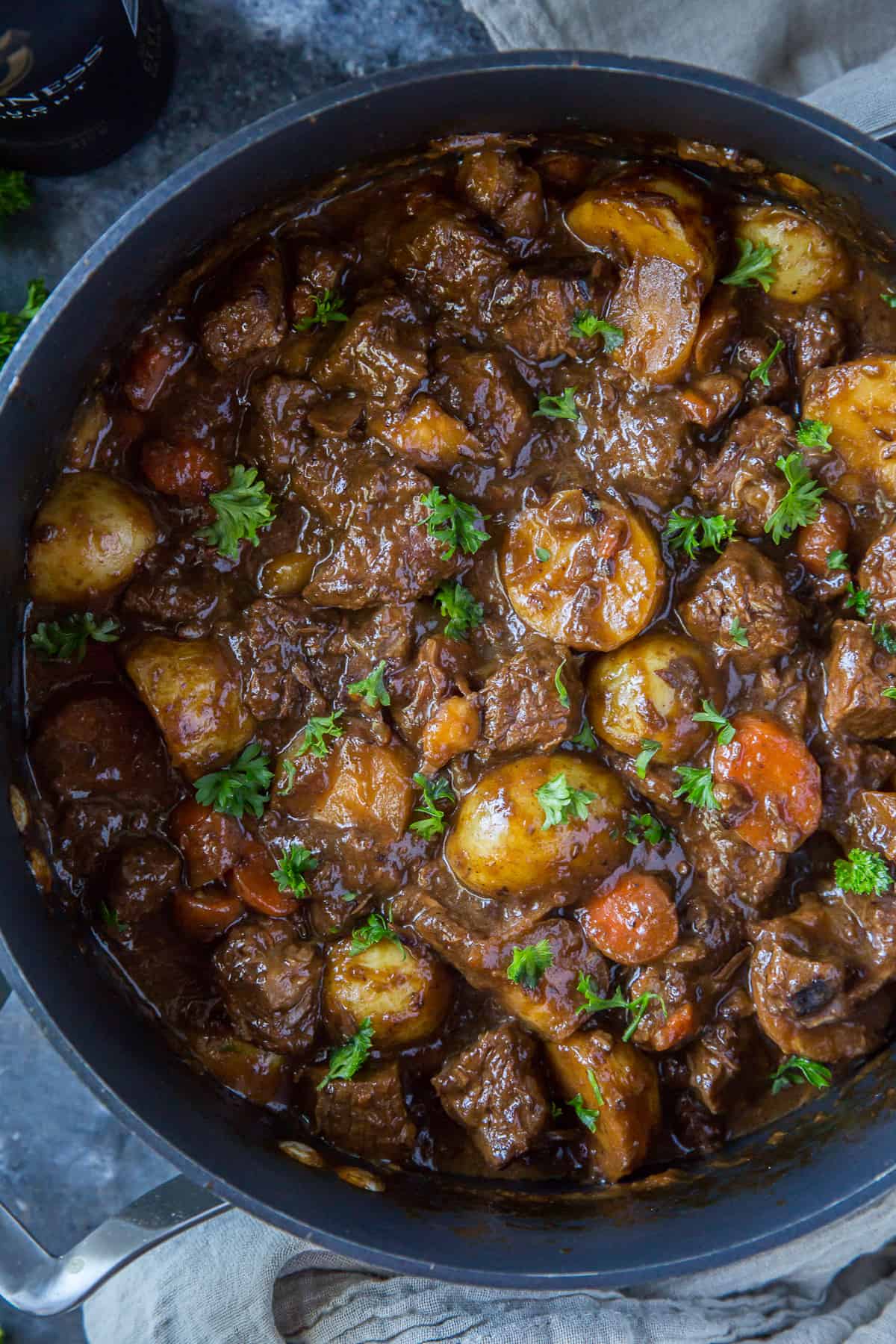 A top down close up shot of Guinness beef stew in a large pot.