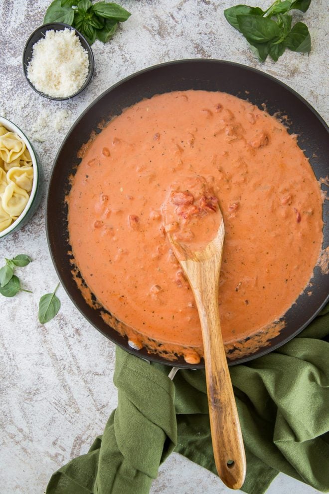 An over the top image of a skillet full of Easy Tomato Cream Sauce.