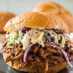 Shredded bbq beef on a bun with coleslaw.