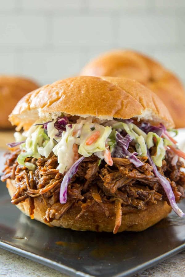 Shredded bbq beef on a bun with coleslaw.