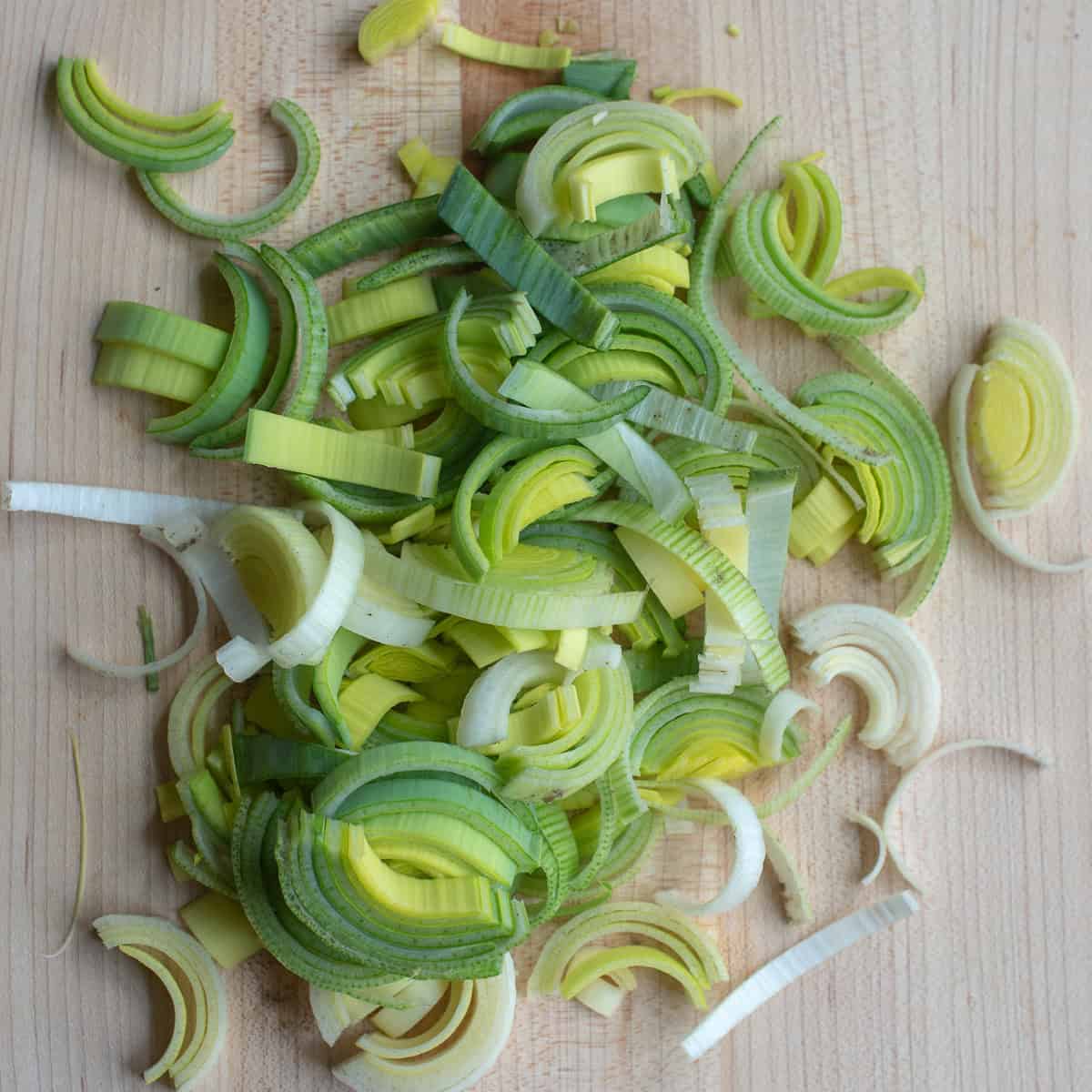 Sliced leeks on a cutting board.