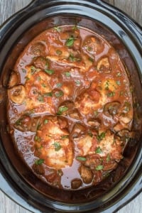 An overhead image of Slow Cooker Chicken Cacciatore in a Crock Pot insert.