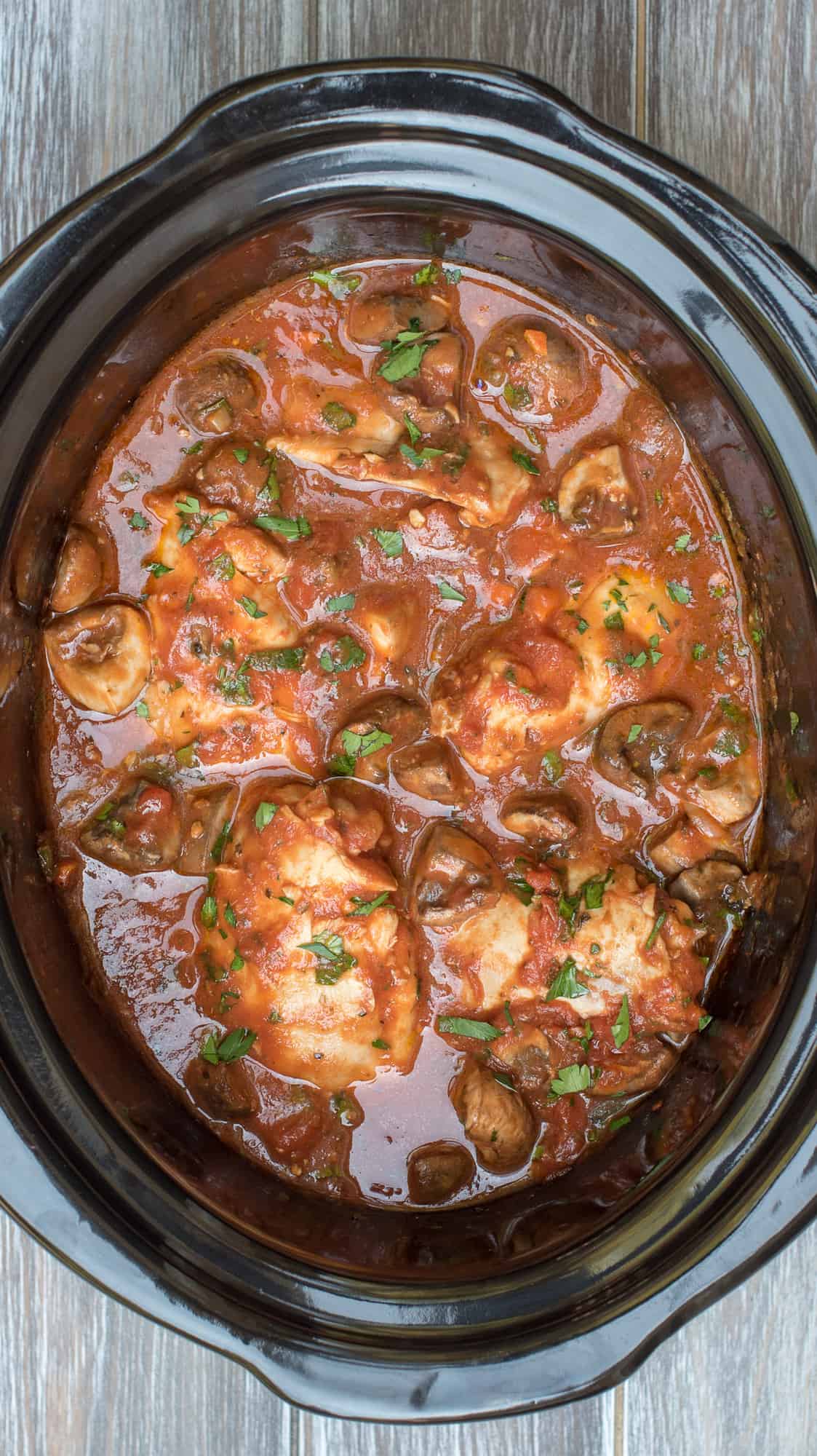 An overhead image of Slow Cooker Chicken Cacciatore in a Crock Pot insert.