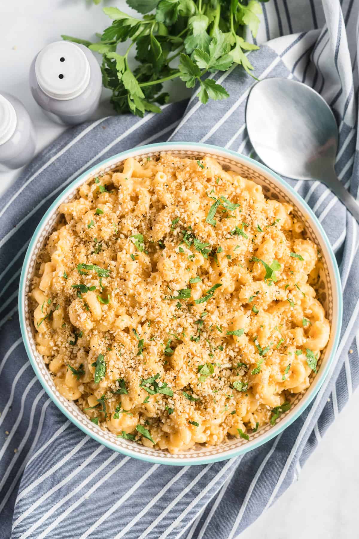 A serving bowl filled with Stovetop Macaroni and Cheese shot from over the top.