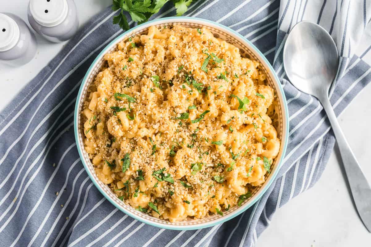 The toasted breadcrumb mixture scattered over the top of the Stovetop Macaroni and Cheese in a large serving bowl.