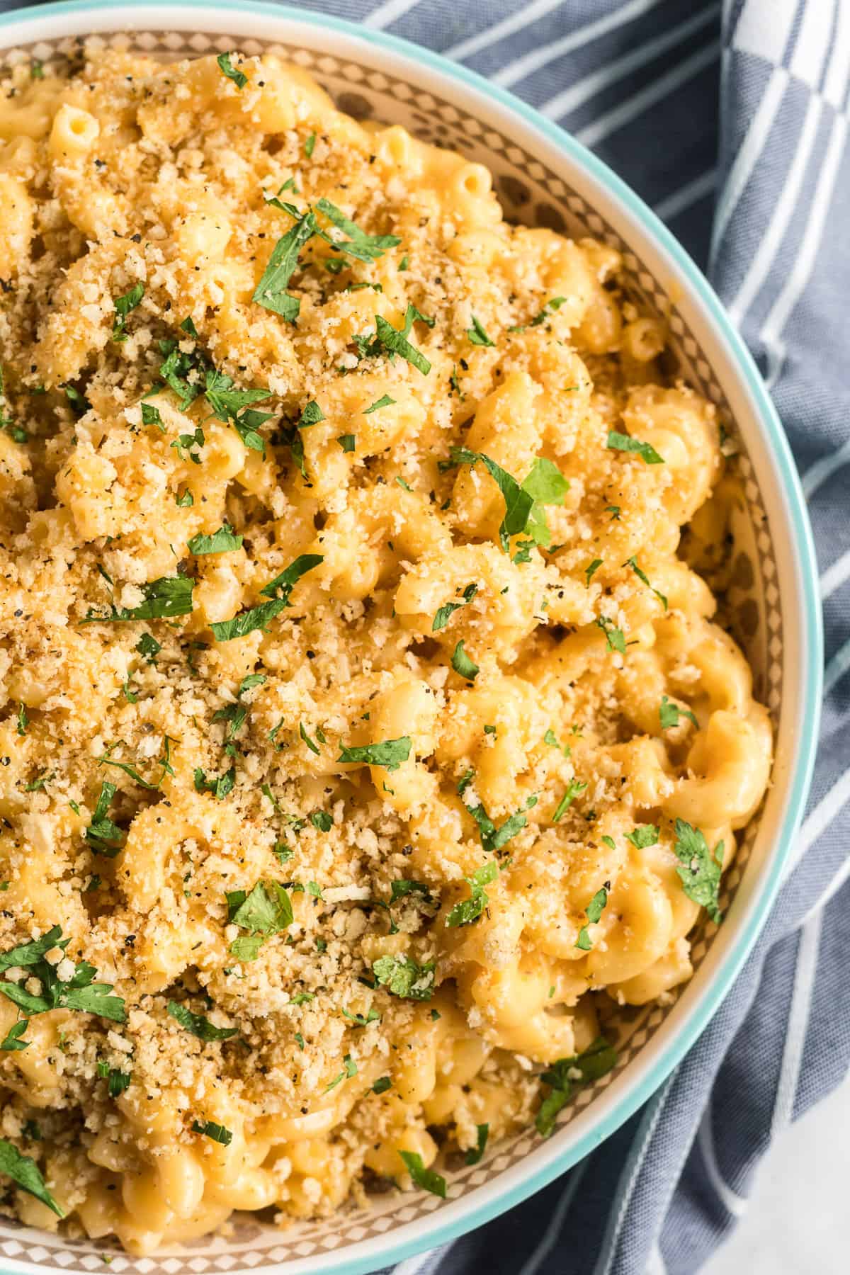 A close up image of the easy macaroni and cheese recipe in a serving bowl shot from over the top.