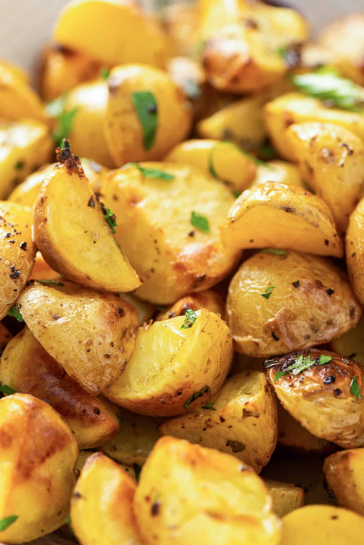 A closeup of a pile of Greek Potatoes.