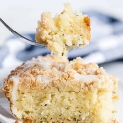 A fork lifts a bite of Lemon Zucchini Coffee Cake.