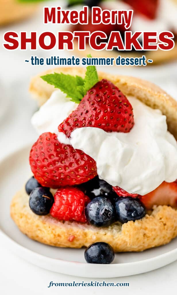 Shortcake sliced in half and stuffed with fresh berries and whipped cream with overlay text.