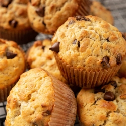 A close up of a pile of muffins.
